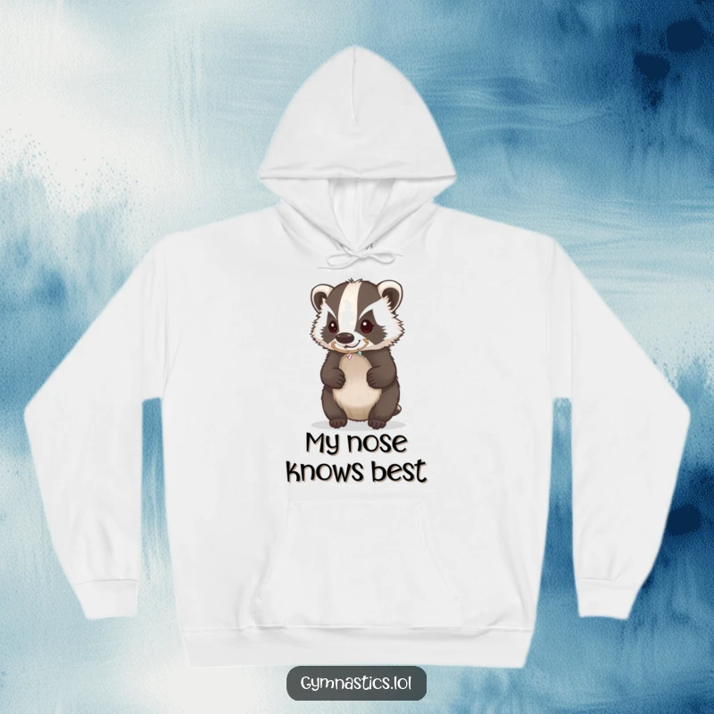Funny Badger Hoodie showing a determined badger balancing a sparkling hoop on its nose, a cozy and humorous wearable art.