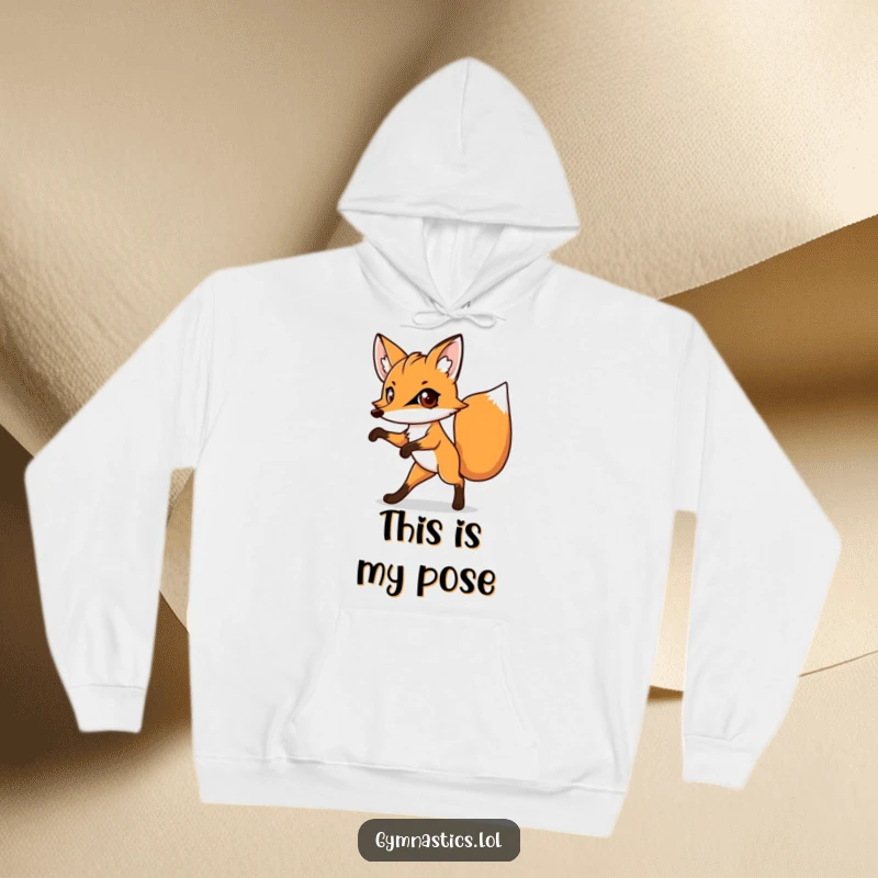 Funny hoodie showcasing a determined fox balancing on one leg, its large eyes fixed with comical intensity.