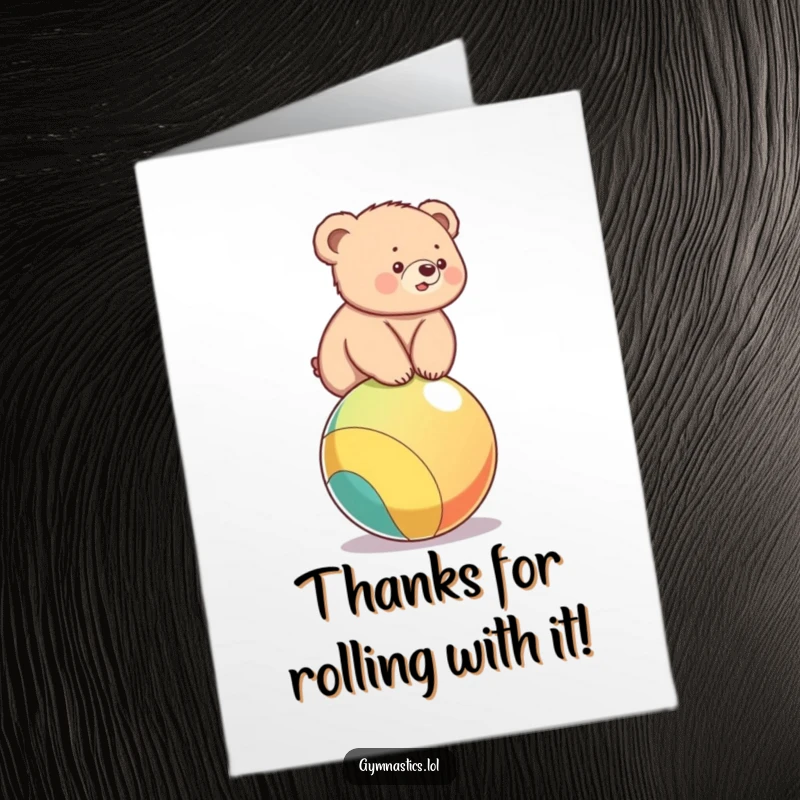 Funny free printable thank you card: A small bear cub struggling to balance on a ball, sending thanks.