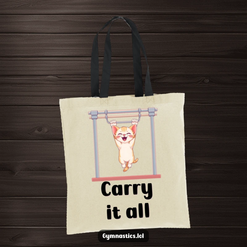 Funny kitten tote bag showing a giggling kitten hanging upside down from uneven bars, ideal for carrying essentials with a dose of feline fun.