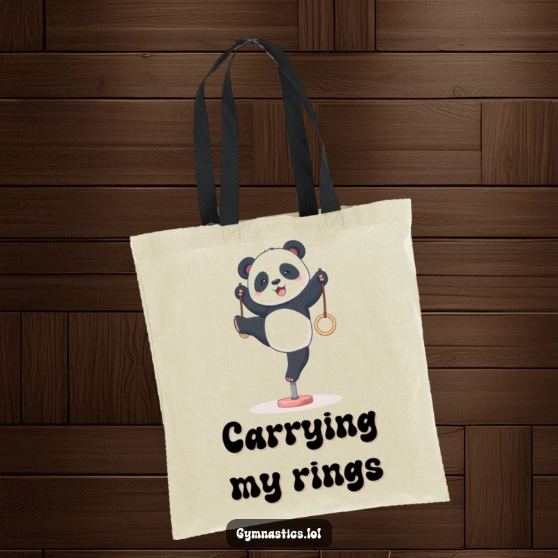 Funny panda gymnastics tote bag, showing a panda attempting a wobbly handstand on tiny rings, perfect for carrying your essentials with a smile.